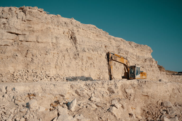 Heavy machinery in quarry. Building materials mining